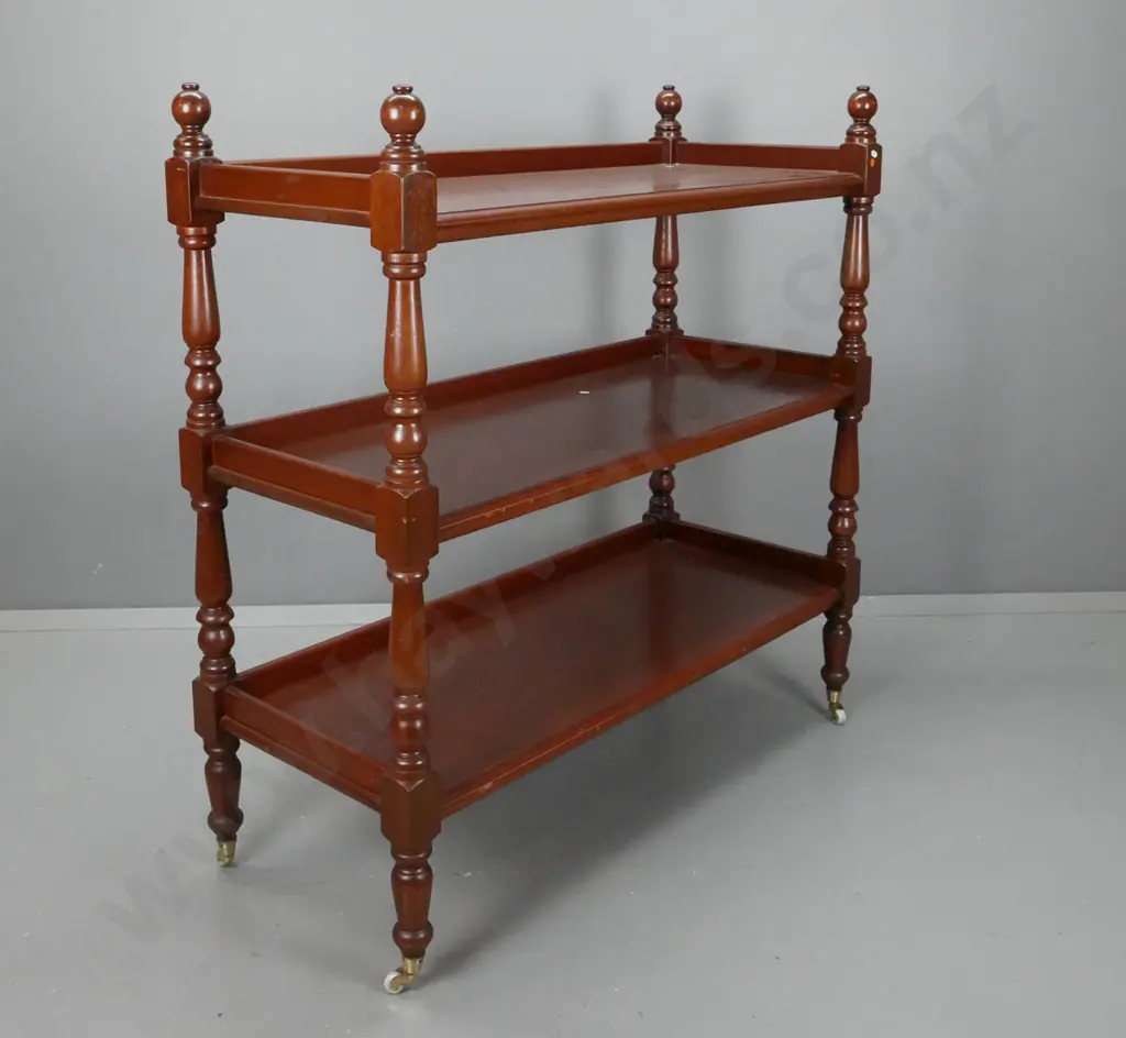 Victorian 3-tiered cedar dumbwaiter w/ turned supports on white china casters. Some scratching to surfaces. H-1250 Image 1++
