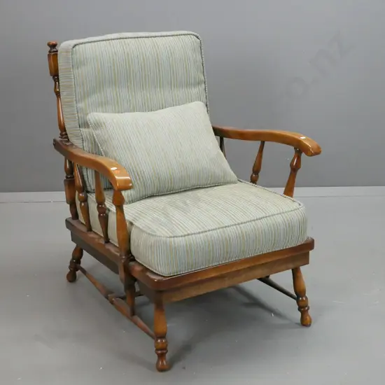 mid-century oak armchair with turned arm and back supports, turned legs and stretcher base, with loose fabric cushions,
