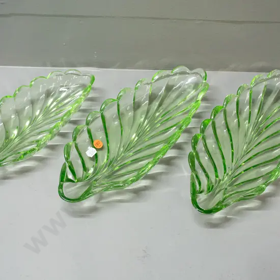 3 leaf shaped moulded green depression glass dishes - matching pair larger and one smaller. One larger has manufacturing