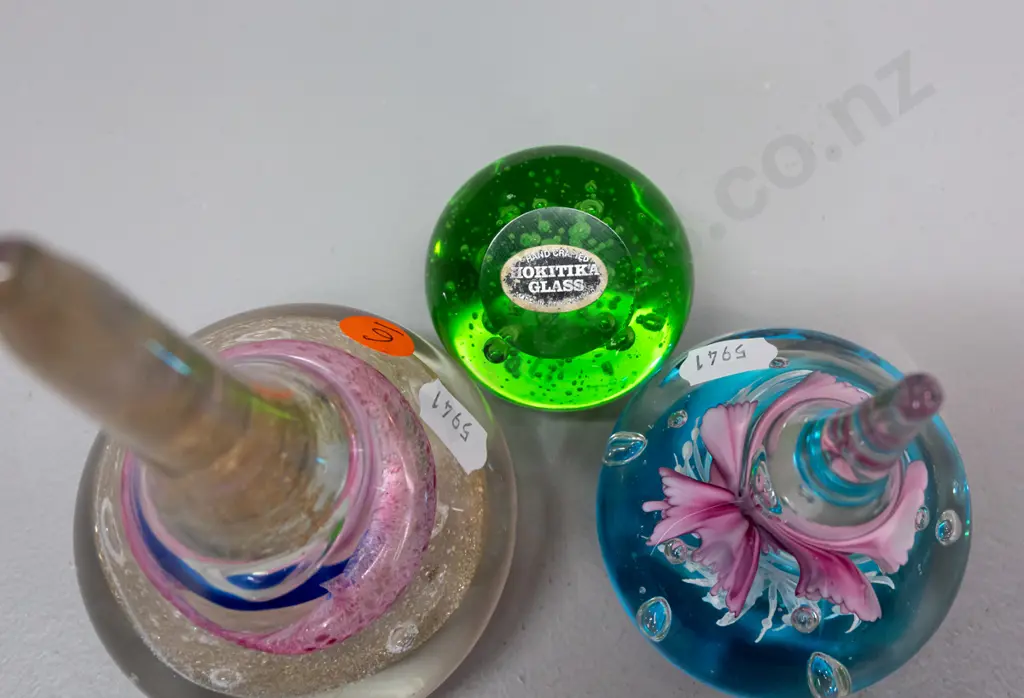 3 glass paperweights - 2 teardrop shaped with floral designs, taller is H-160, and a small Hokitika green bubble globe Image 1++