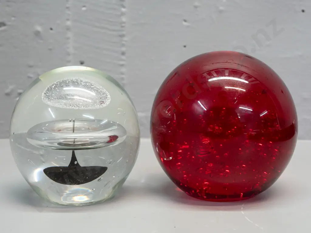 2 heavy glass globe paperweights - red with bubbles has unreadable maker's mark on base and some scratches H-100 Image 1++
