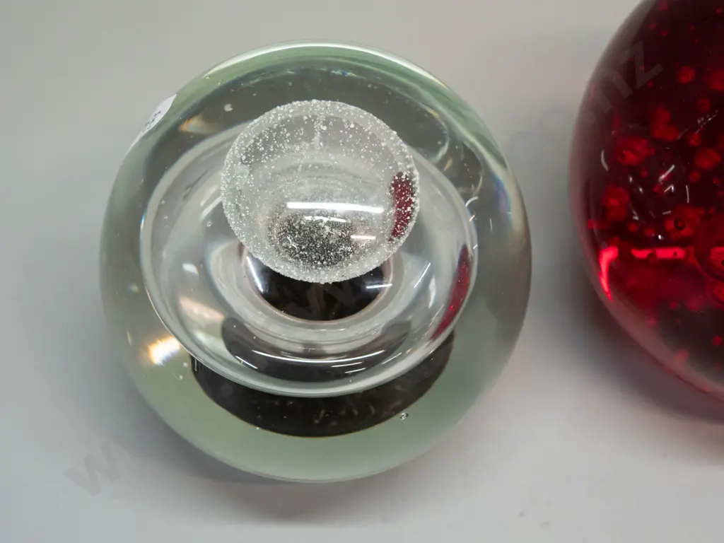 2 heavy glass globe paperweights - red with bubbles has unreadable maker's mark on base and some scratches H-100 Image 1++