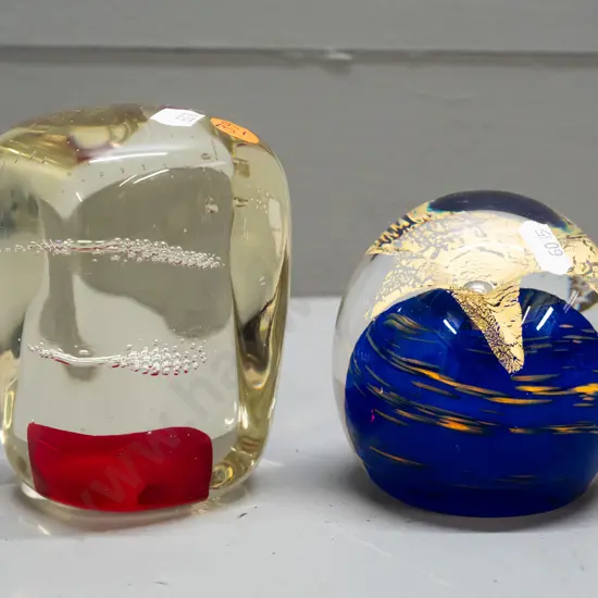 2 art glass paperweights - clear with red base and bubble design H-100 other with gilt flower and blue swirl