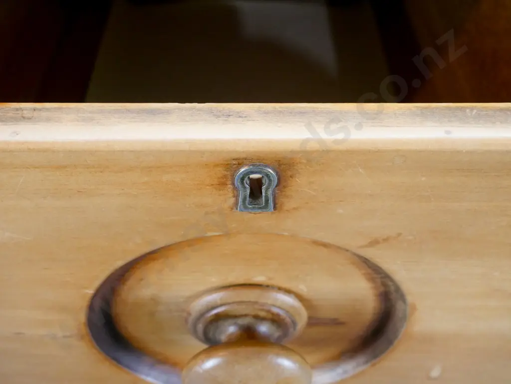 vintage rimu 8-drawer chest with turned columns and wooden knobs, brass escutcheons, on plinth base. Split to one side, Image 1++