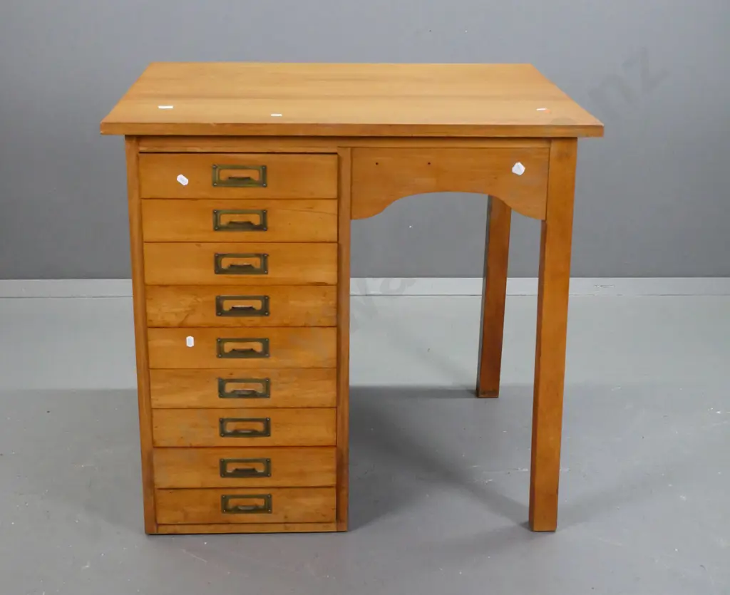 small colonial rimu desk with 9 index drawers, brass label handles, panel sides, shaped kneehole Image 1++
