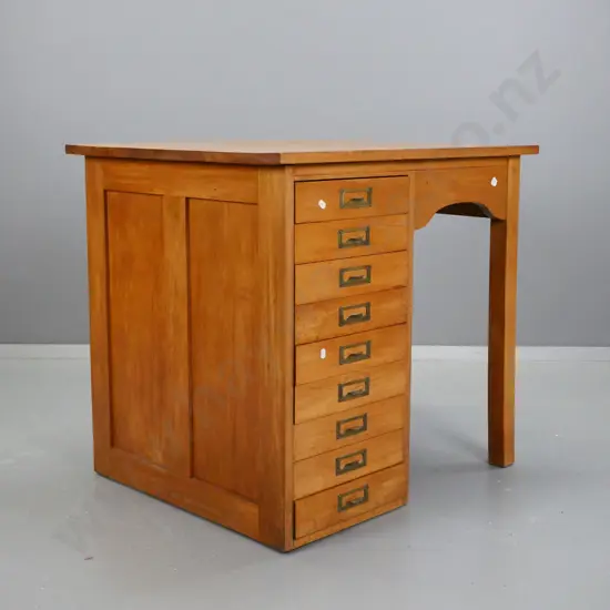 small colonial rimu desk with 9 index drawers, brass label handles, panel sides, shaped kneehole