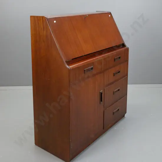 retro mahogany fold-front desk, one long drawer, cupboard door flanked by three small drawers, fold-front exposing