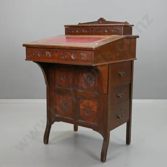 Assetic walnut, davenport, with lift-up lid exposing letter rack, red tooled leather slop front lifting