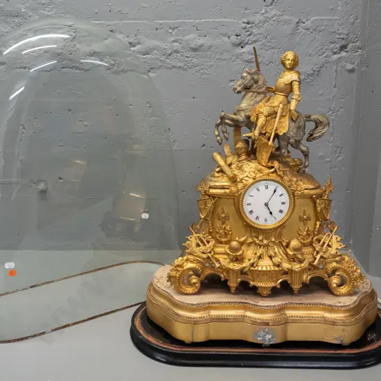 vintage ornate brass and gilded cast metal clock on gilded plaster base, on Victorian glass-domed timber base not