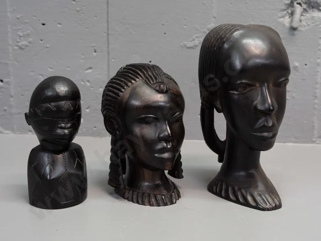 3x African carved hardwood busts, smallest has hard to read label on base, mentions Portugal, Mozambique, ebony, WWII - Image 1++