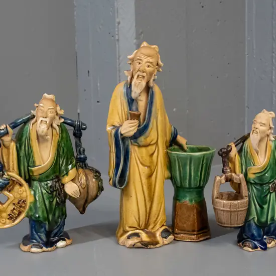 3 Chinese earthenware "mud men" figures - largest has fret to base H-230