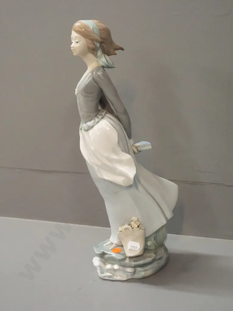 large Lladro figurine: standing woman with book and flower basket H-370 W-110 across base Image 1++