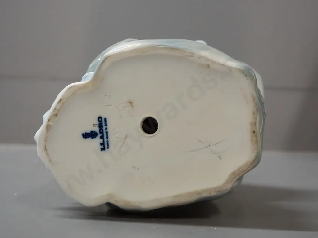 large Lladro figurine: standing woman with book and flower basket H-370 W-110 across base Image 1++