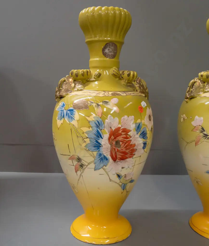 pair of Satsuma style hand decorated floral & bird motif vases with fluted bud-shaped top, applied floral handles. Both Image 1++
