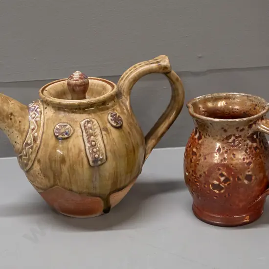 2 pieces of studio pottery, unknown marks - teapot with applied decoration H-160 L-220 and a jug with wood-fired glaze -