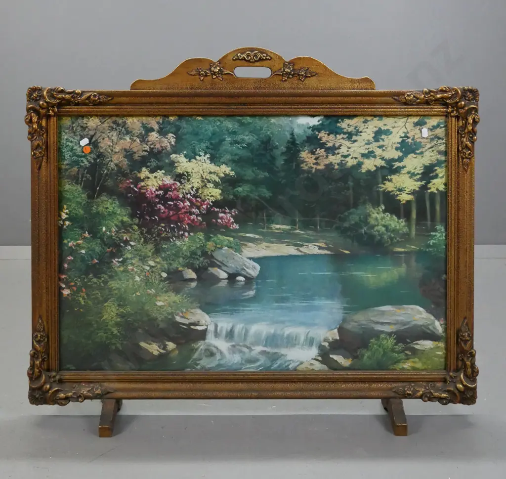 Mid-century fire screen gilded & stippled frame w/ foliate corners & shaped top handle. Glazed print of forest scene. Image 1++