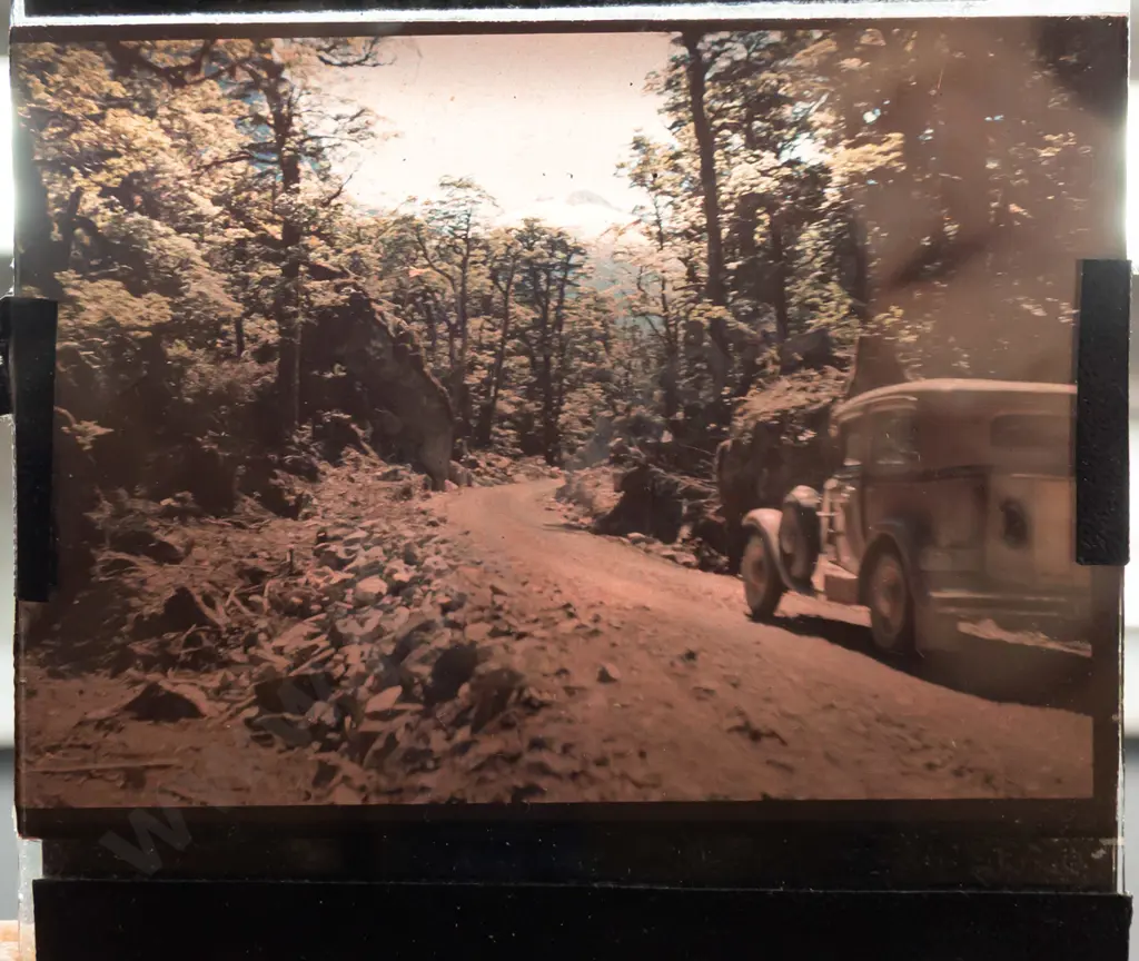 wooden box with assorted glass lantern slides, mostly (hand painted?) amateur houses and scenics, including a 16mm film Image 1++