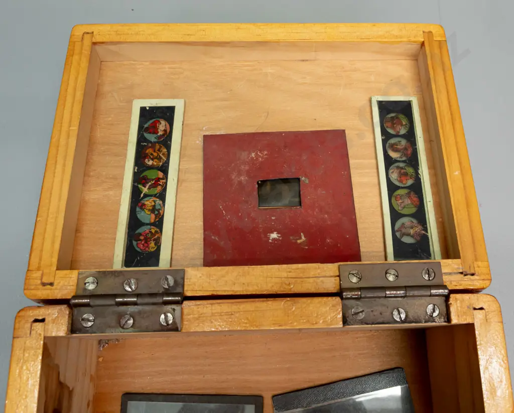wooden box with assorted glass lantern slides, mostly (hand painted?) amateur houses and scenics, including a 16mm film Image 1++