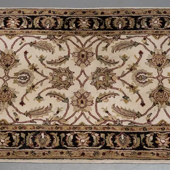 woolen Indian floor rug (Kohinoor) swirling foliate & floral decoration, ivory, red & black colours H1820 W1210