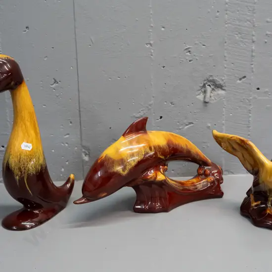 3 pieces of brown & mustard Blue Mountain pottery, dolphin, goose & duck Tallest 290
