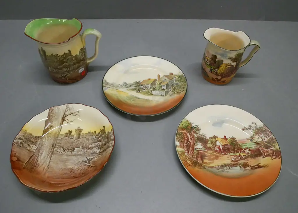 5x Royal Doulton mixed lot: jug & plate Arundel Castle scene, jug & 2x plates Rustic England. One plate crazed & stained Image 1++