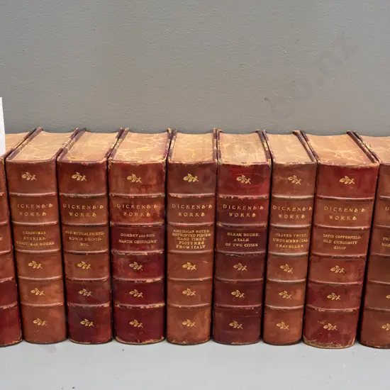 9 leather bond & marble covered volumes of Dicken's works (1893)