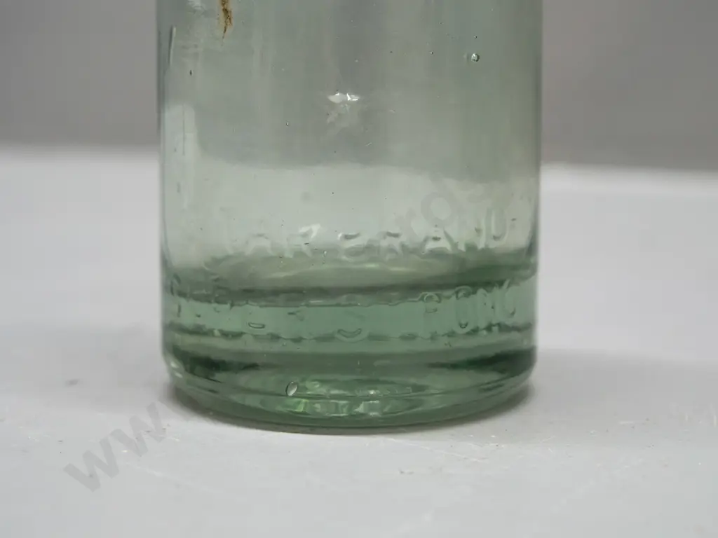 2 codd marble bottles - Lane & Co Dunedin with clear marble, a few chips, and smaller one with black or dark green Image 1++