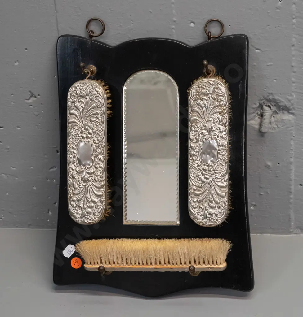 vintage wall hanging brush set with arch shaped mirror, 3 brushes with plated backing, some dents. H-320 W-220 Image 1++