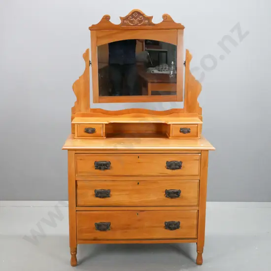 Rimu dresser, carved crest above mirror, shelf with 2 small drawers below, 3 long drawers, on short