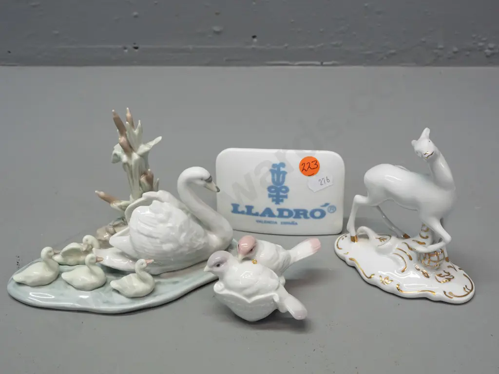3x pieces of Lladro - swan & cygnets, 1991 Christmas birds, and display sign - and a Royal Dux deer figure. Swans H-110 Image 1++