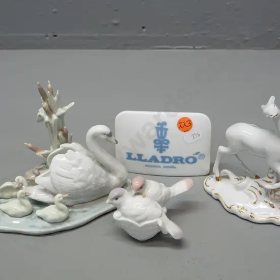 3x pieces of Lladro - swan & cygnets, 1991 Christmas birds, and display sign - and a Royal Dux deer figure. Swans H-110