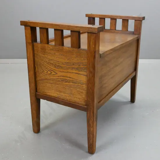 arts & craft style oak lift up lid piano stool, square tapered legs, paneled front & sides, some stains to seat top