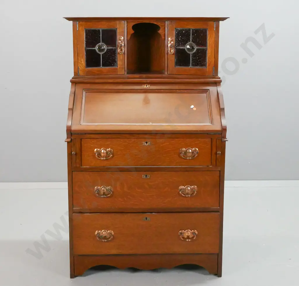 vintage arts & crafts style oak drop-front bureau with 3 lower drawers, 2 leadlight cupboard doors in top, Image 1++
