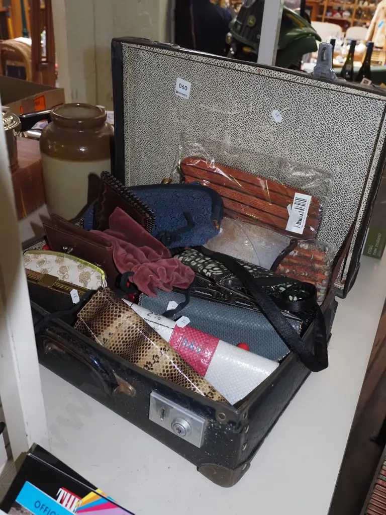 suitcase of clutch purses and wallets Image 1++