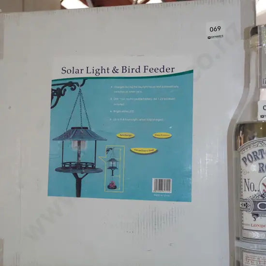 boxed as new solar light, bird feeder
