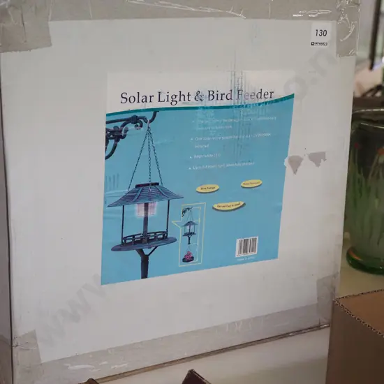 boxed as new solar light and bird feeder