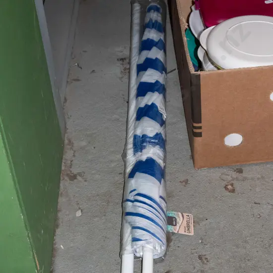 as new blue and white beach umbrella