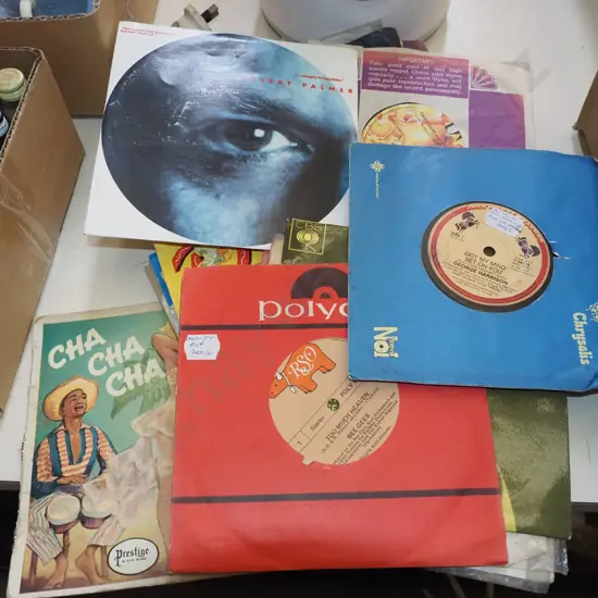 stack of 45s; George Harrison, Robert Plant etc