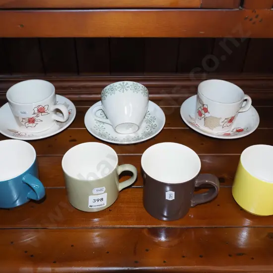 assorted Crown Lynn coffee cups and saucers