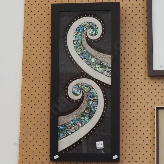 framed sand and paua koro art
