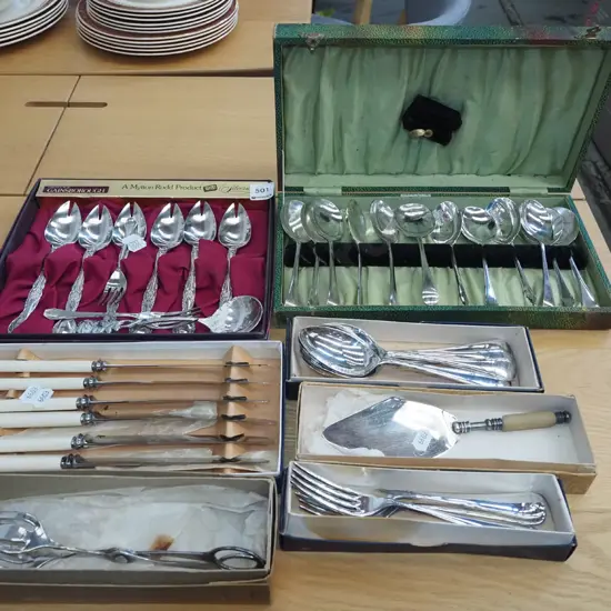 assorted plated cutlery; spoons, knives, tongs etc