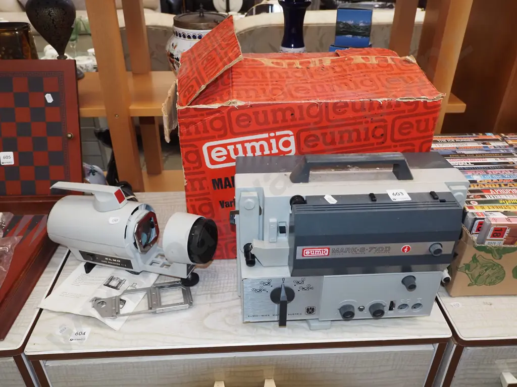 Eumig 8mm cine camera with box and an Elmo slide projector Image 1++
