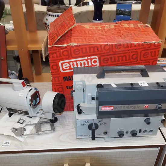 Eumig 8mm cine camera with box and an Elmo slide projector