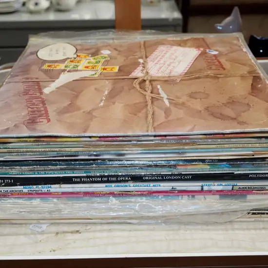 stack of LPs; Cheech and Chong, Simon & Garfunkel etc