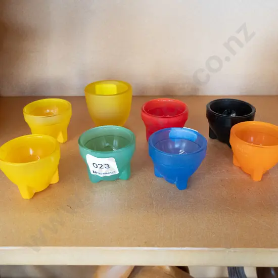 assorted coloured glass egg cups