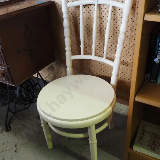 white spindle back chair