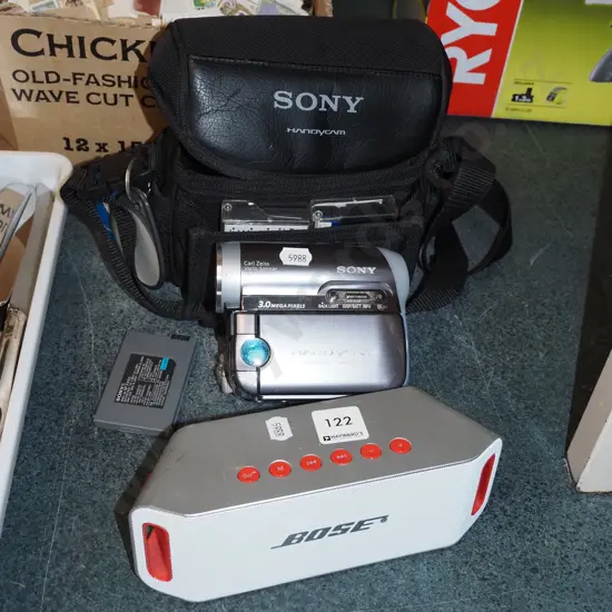 Sony handi-cam and case, small Bose blue tooth speaker