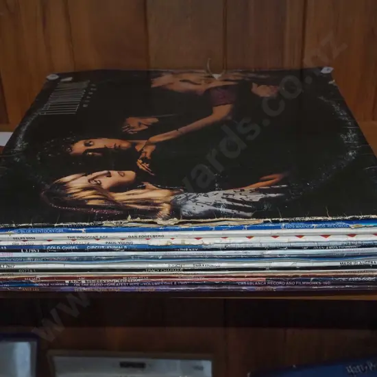 stack of LPs; Fleetwood Mac, Paul Young, Cold Chisel etc