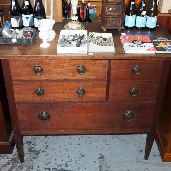 arts and craft oak and rimu 4 drawer chest with brass drop handles - some signs of borer in back