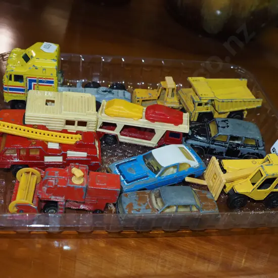 plastic tray of toy vehicles